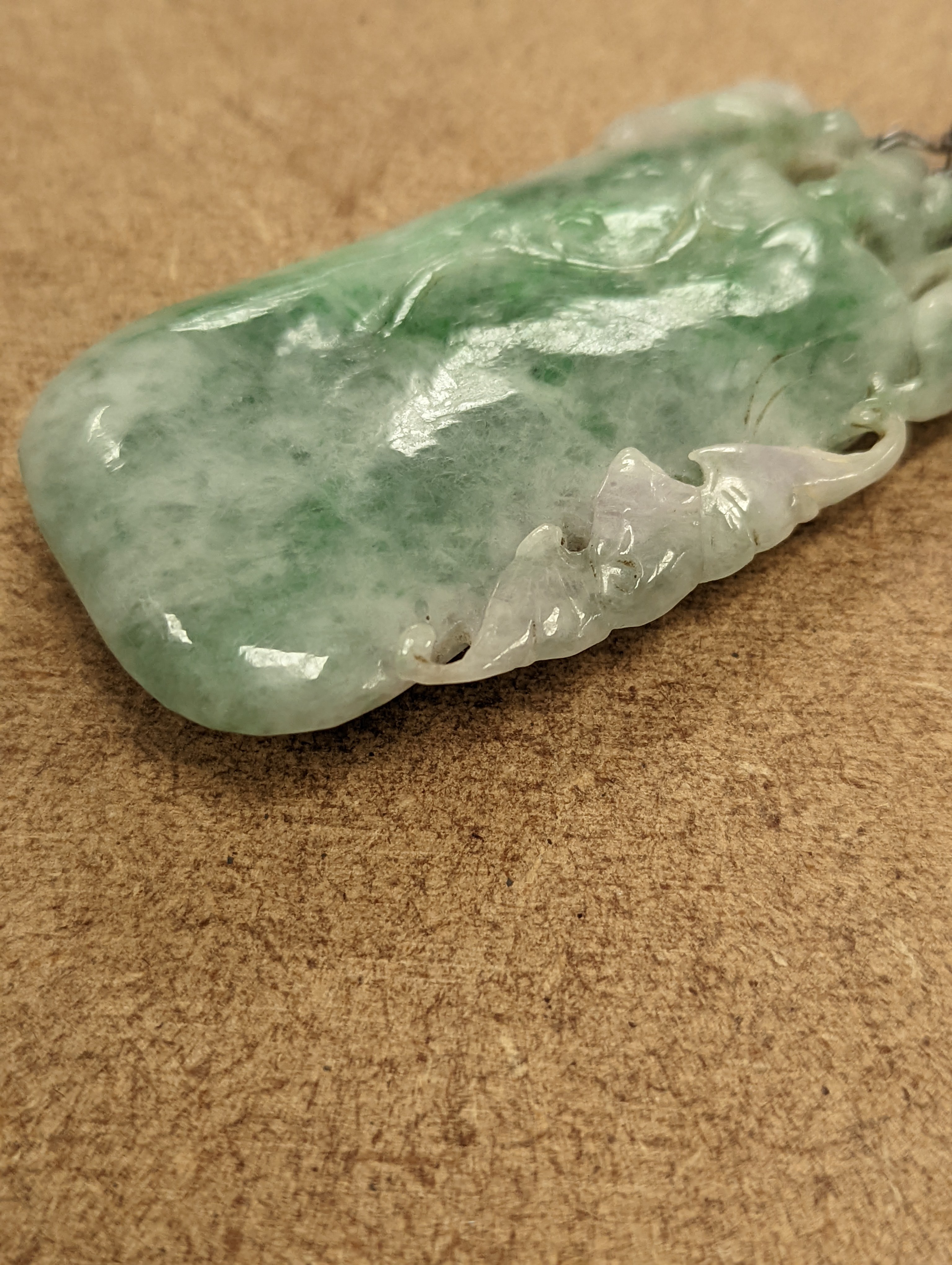 A Chinese mottled jadeite plaque 8cm